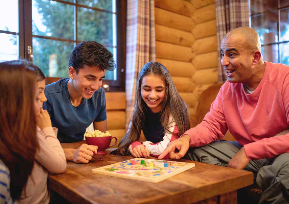Family playing indoor board games.