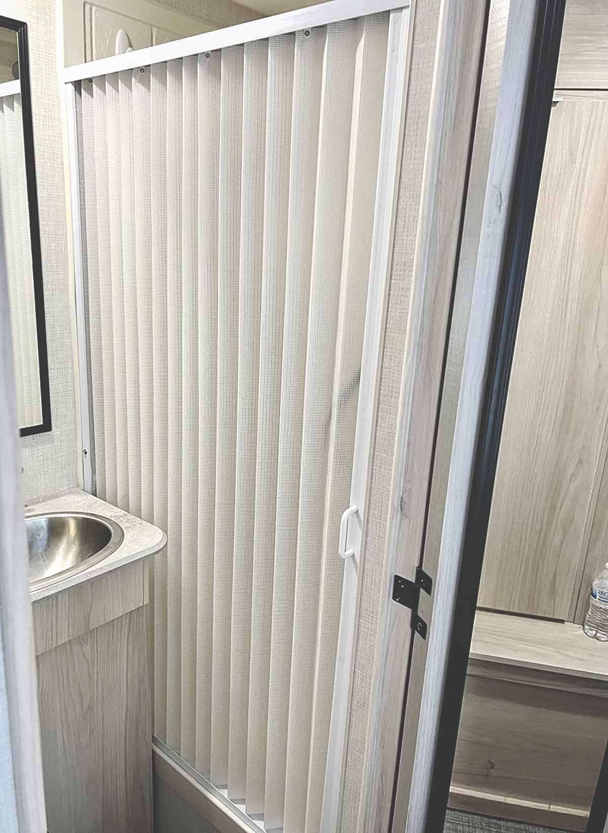 Plastic accordion shower door 